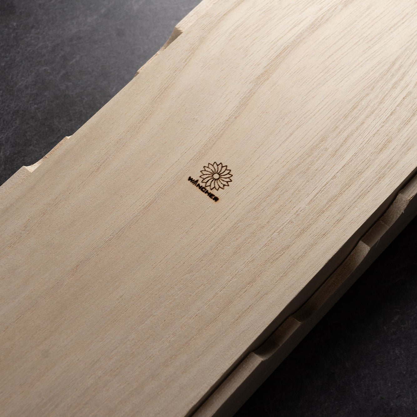 Wooden product with a Wancher on a dark background