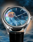 Watch with a unique face featuring a moon phase design on a blue textured background Wancher Dream Moonphase Kaguya watch with raden mother of pearl dial