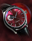 Luxury watch with red face and black leather strap on a dark background Luxury moonphase watch with Red Pantone ink dyed raden dial and graphic moon disk