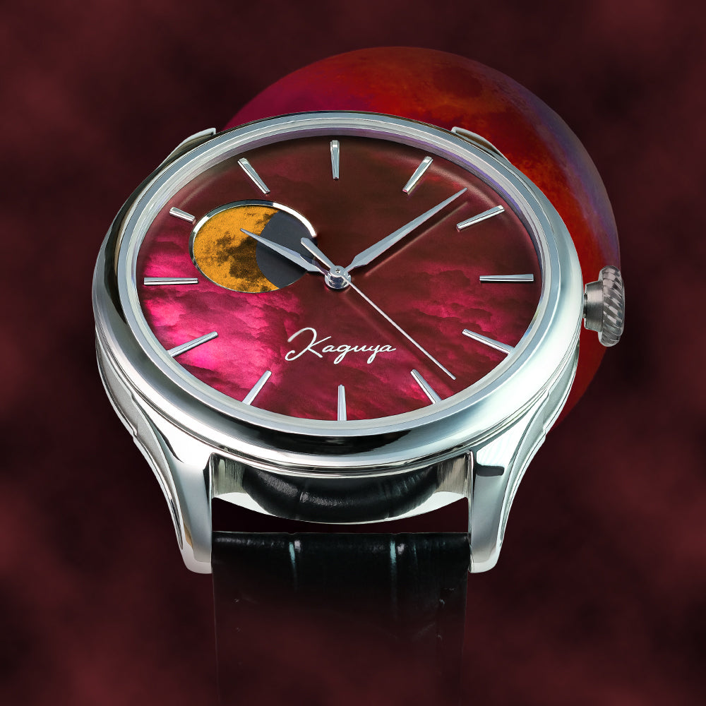 Watch with a red face and silver case on a dark background TSUKIMI Gold Moon Disk Dial  Dream Moonphase Kaguya AKANE Wancher Watch H7M01