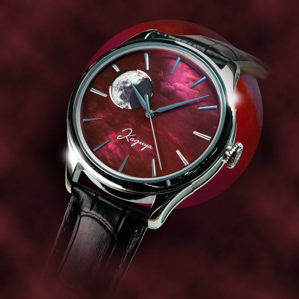 Luxury watch with red face and black leather strap on a dark background Wancher Kaguya AKANE moonphase watch featuring raden mother of pearl artistry