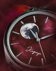 Watch face with moon phase indicator and 'Kaguya' branding on a red raden mother of pearl watch dial background
