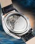 Close-up of a watch with a visible mechanical movement on a blue and orange gradient background Hangzhou Watch Factory 7th generation H7M01 Caliber Movement