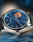 Luxury watch with blue dial and black leather strap on a dark background
