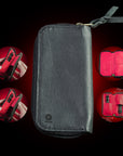 Black Deer leather wallet with red interior on a black background By Wancher Handcrafted deer leather watch pouch with embossed shibo texture
