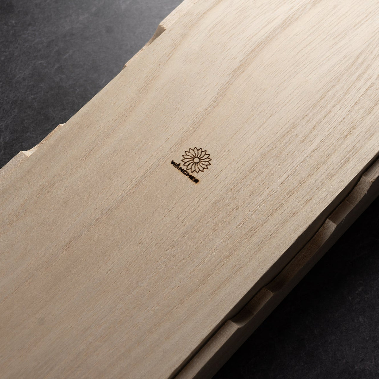 Wooden product with a Wancher on a dark background