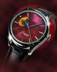 Watch with a red face and black strap on a dark background  TSUKIMI Gold Moon Disk Dial  Dream Moonphase Kaguya AKANE Wancher Watch 