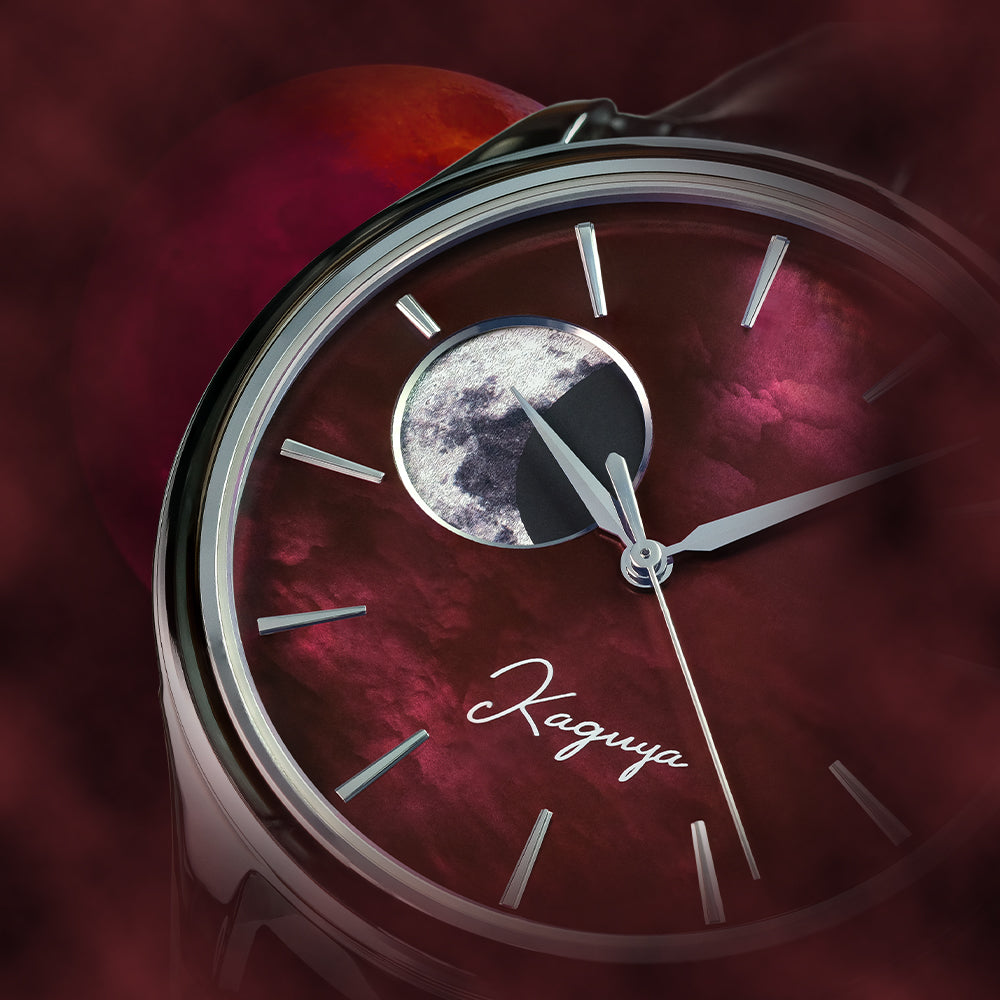 Watch face with moon phase indicator and &#39;Kaguya&#39; branding on a red raden mother of pearl watch dial background