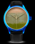 Watch with a blue case and black strap on a black background Collectible Japanese Urushi watch Dream Watch Chawan-Iro Matcha with textured Ishime Kinma lacquer craftsmanship Wancher Watch 